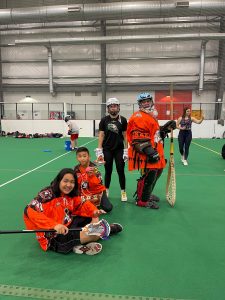 Siksika youth participants post for a photo while learning adaptive lacrosse in Calgary. 